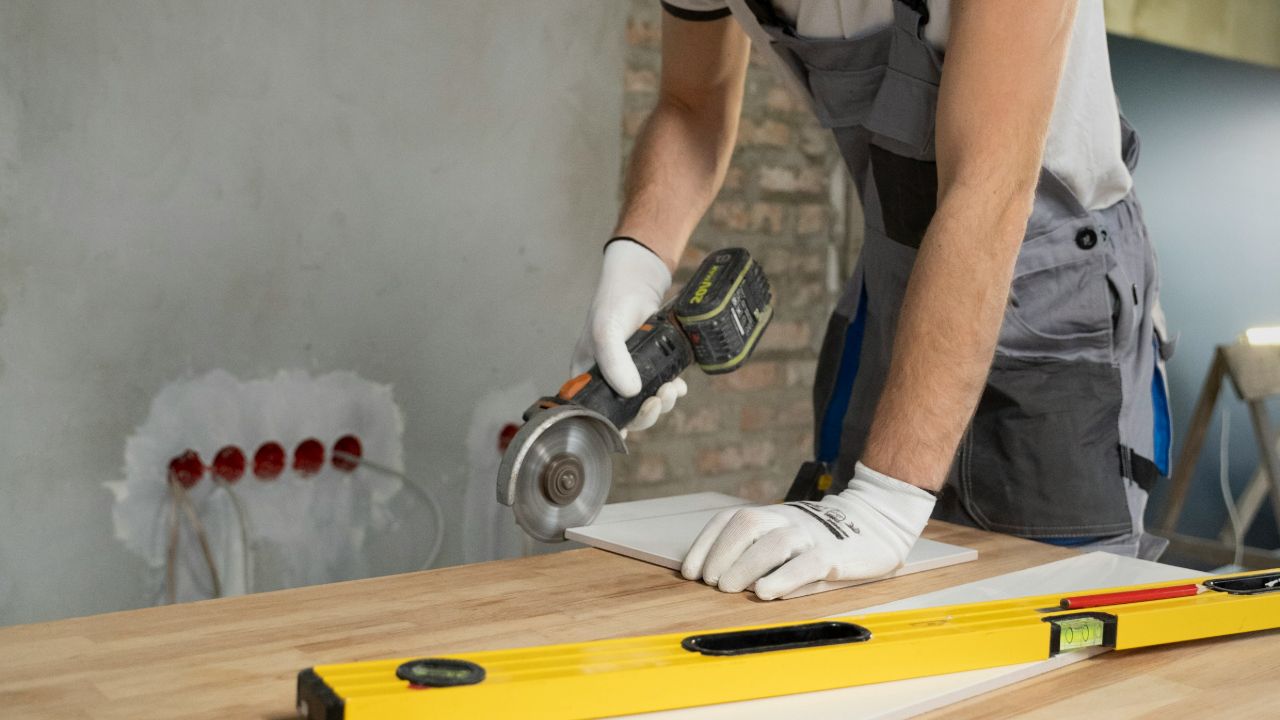 Tiler cutting a tile