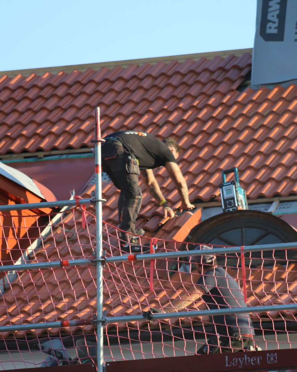 Roofer on scaffolding